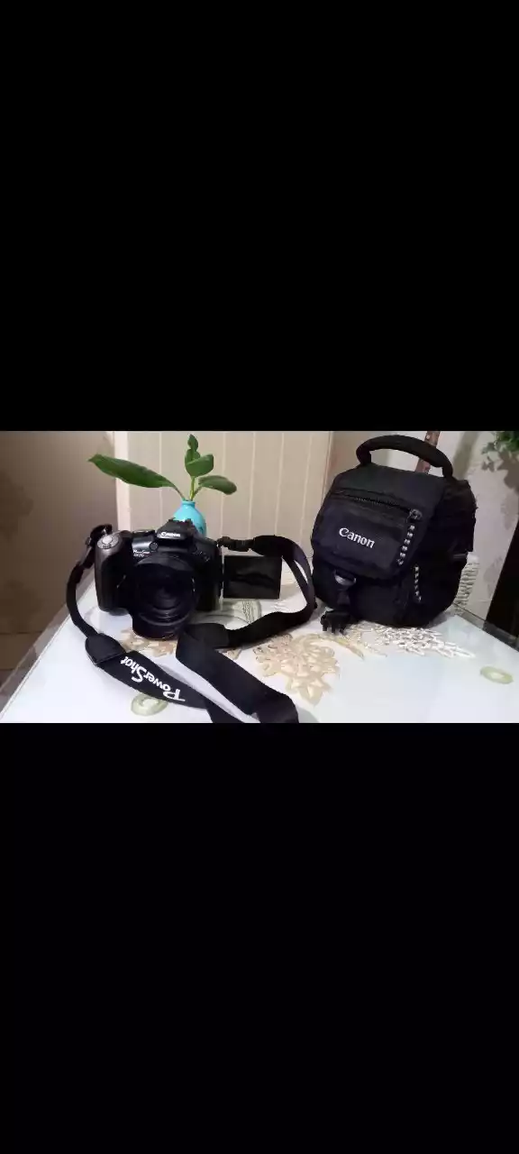 دوربین کنون حرفه ای sx20 دست دو