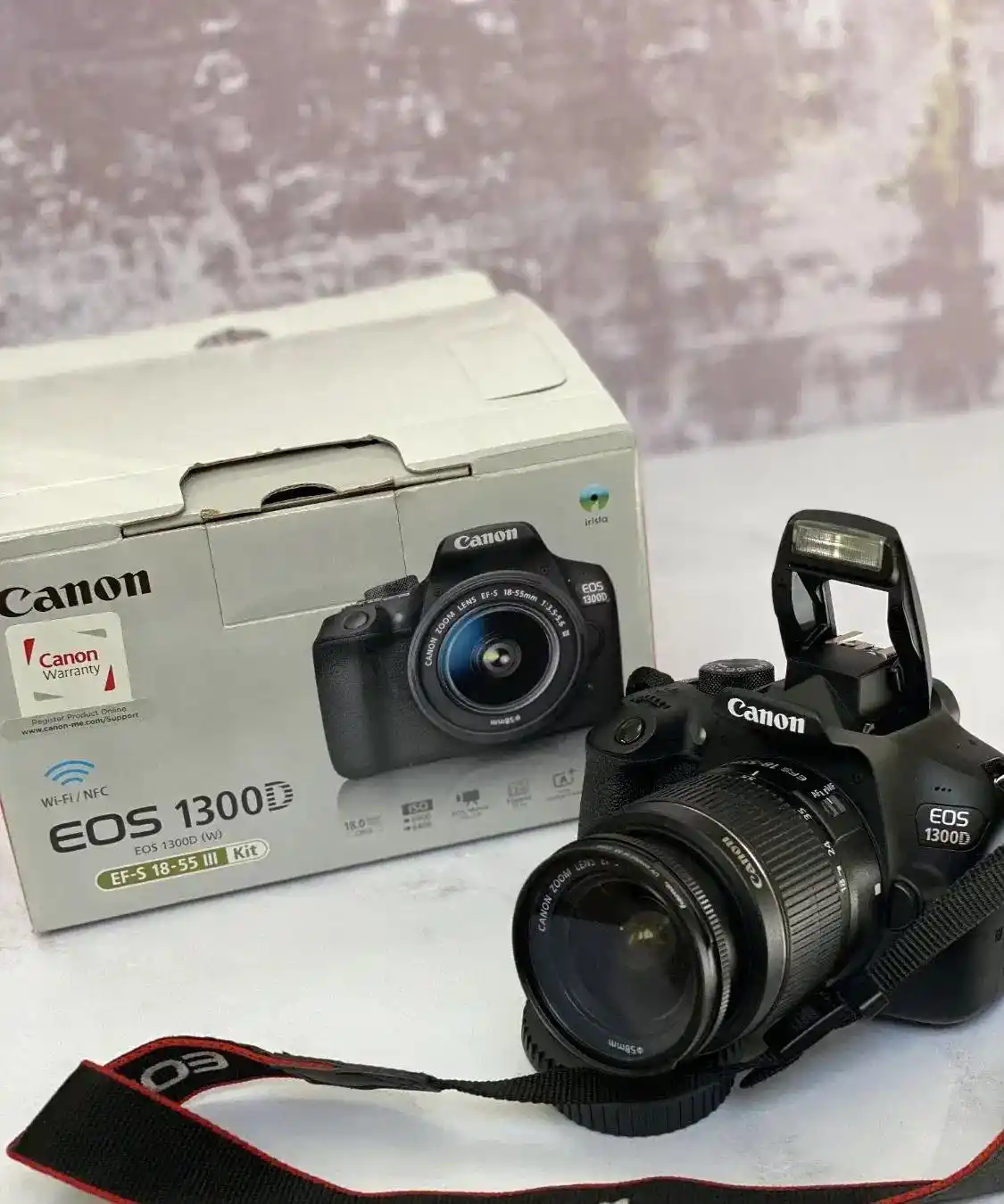 دوربین عکاسی دیجیتال کانن EOS 1300D دست دو