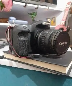 دوربین عکاسی کانن مدل 50d + لنز 18-200 دست دوم